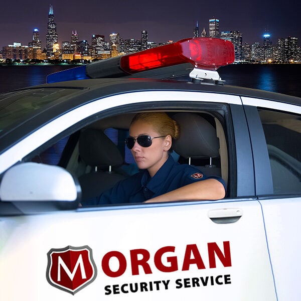 Mobile Patrols - Morgan Security Guard in uniform on mobile patrol in a Morgan Security Mobile Vehicles.