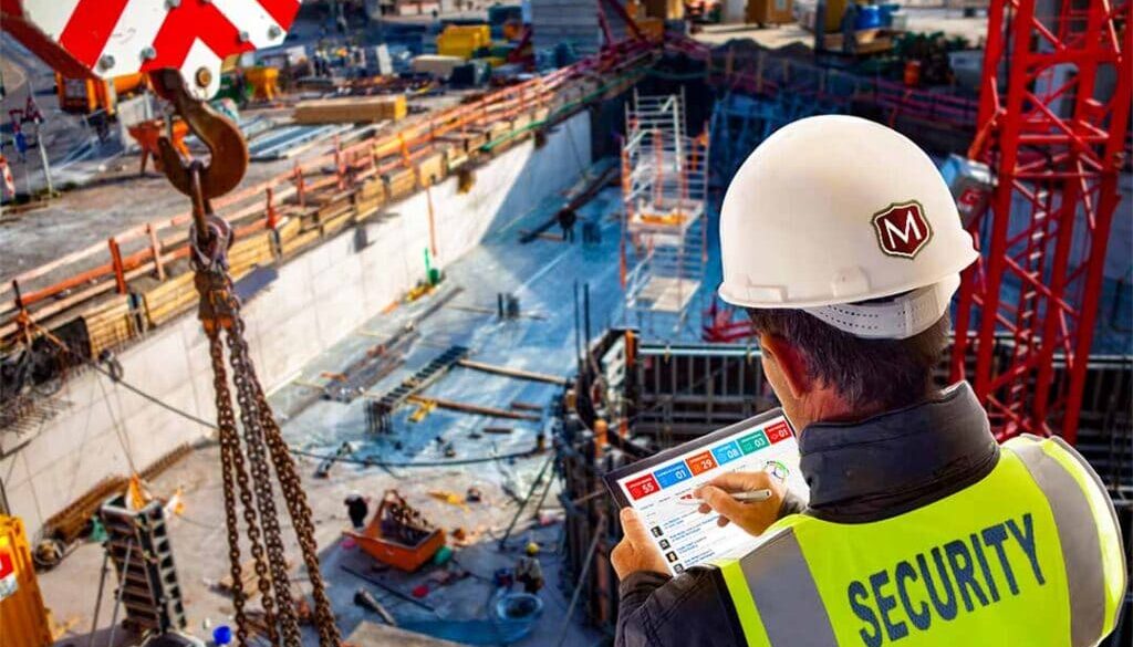 Morgan Security's Construction Site Security Guards - Supervisor viewing Guard Tracking Software on Ipad