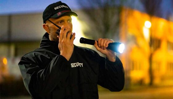Morgan Security guard performing foot perimeter patrols. Security Guards are backed up with CCTV Monitoring, Mobile Patrols, and Guard Tracking services in Illinois, Indiana, and Chicago.